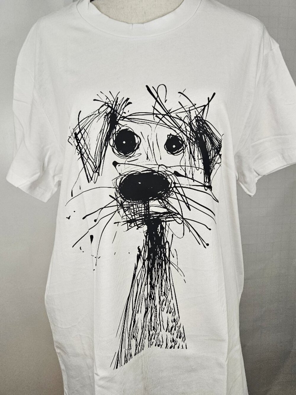 Multiple sizes of this Loose Crew-Neck White Short-Sleeved 100% Cotton T-Shirt